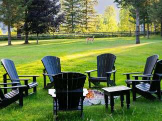 Experience serene outdoor living with this inviting fire pit area, perfect for gathering with loved ones.