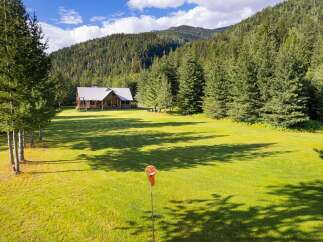 Experience serene living in this stunning property nestled amidst lush greenery and majestic mountains.