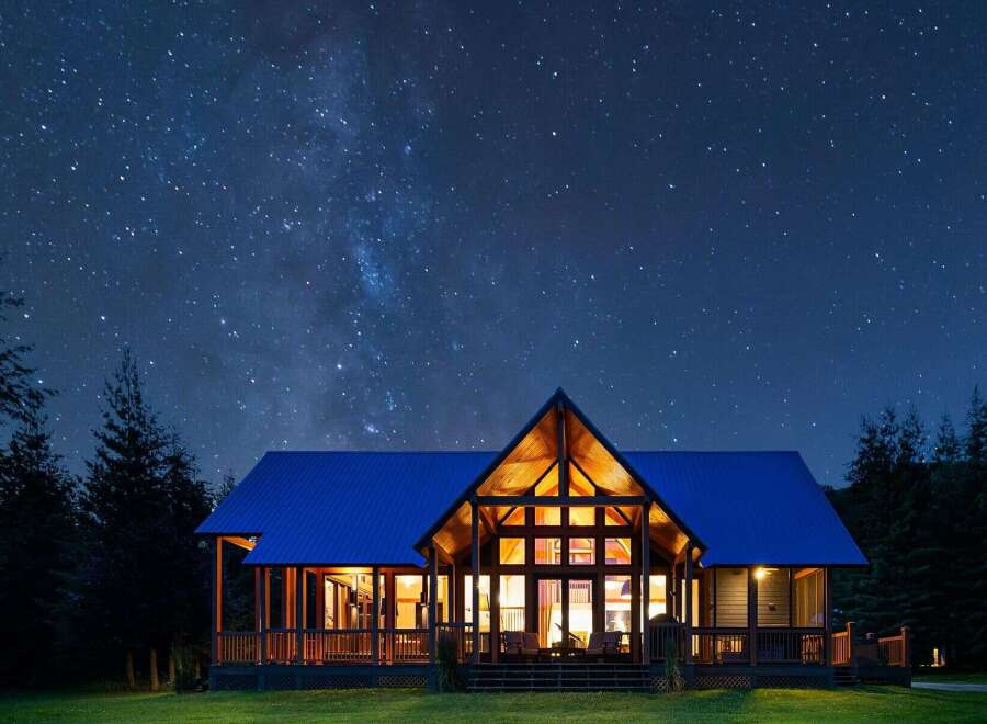 Experience the magic of stargazing from this stunning modern cabin, nestled amongst tall pine trees.