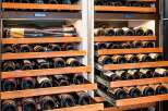 Experience the ultimate in wine preservation with this state-of-the-art dual-zone wine cellar, featuring multiple pull-out wooden shelves designed to store your collection at optimal temperatures.