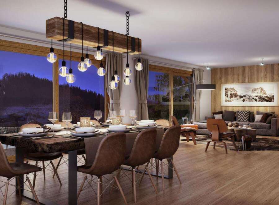Experience luxurious mountain living in this stunning dining and living area, featuring a rustic wooden dining table set for a feast and a cozy fireplace perfect for chilly evenings.