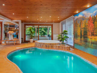 Indulge in ultimate relaxation with this indoor pool and spa oasis.