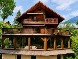 Experience luxurious mountain living in this stunning wooden chalet, featuring expansive balconies and a sun-drenched conservatory with panoramic views.