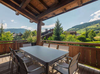 Enjoy breathtaking mountain views from this stunning balcony, perfect for al fresco dining or morning coffee.