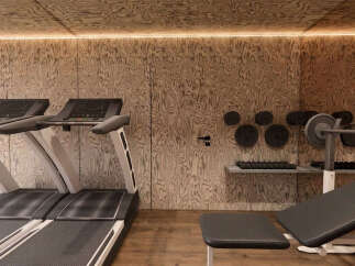 Elevate your fitness routine in this modern home gym, featuring two state-of-the-art treadmills for cardio workouts.
