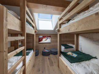 Experience cozy mountain living in this charming bunk room, perfect for families or groups.