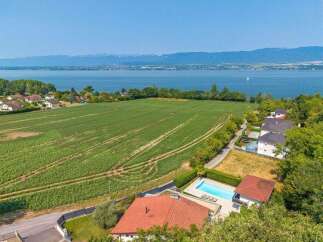 Experience luxurious living with this stunning property offering breathtaking lake and mountain views.