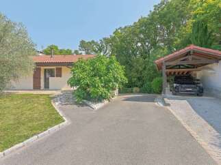 Discover this charming property featuring a cozy single-story home with a welcoming facade and a well-maintained lawn.