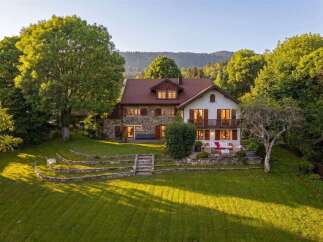Nestled amidst lush greenery and rolling hills, this charming property offers a serene escape.
