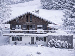 Experience a winter wonderland in this charming alpine chalet, nestled amidst snow-covered trees and rolling hills.