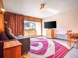 Experience comfort and style in this inviting living space, featuring a plush sofa perfect for relaxation.