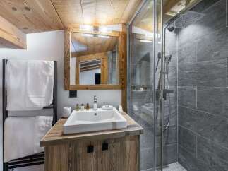 Experience rustic charm and modern luxury in this beautifully appointed bathroom.