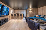 Experience ultimate relaxation in this luxurious home theater and entertainment space.