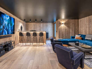 Experience ultimate relaxation in this luxurious home theater and entertainment space.