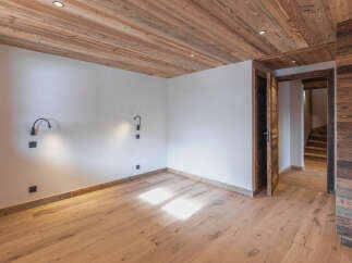 Experience rustic charm in this beautifully appointed room featuring warm, natural wood finishes throughout.