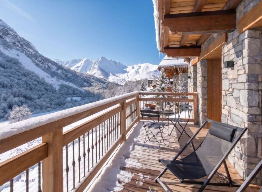 Enjoy breathtaking mountain views from this charming balcony, perfect for a winter getaway.