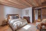 Experience rustic charm and modern comfort in this beautifully appointed bedroom.