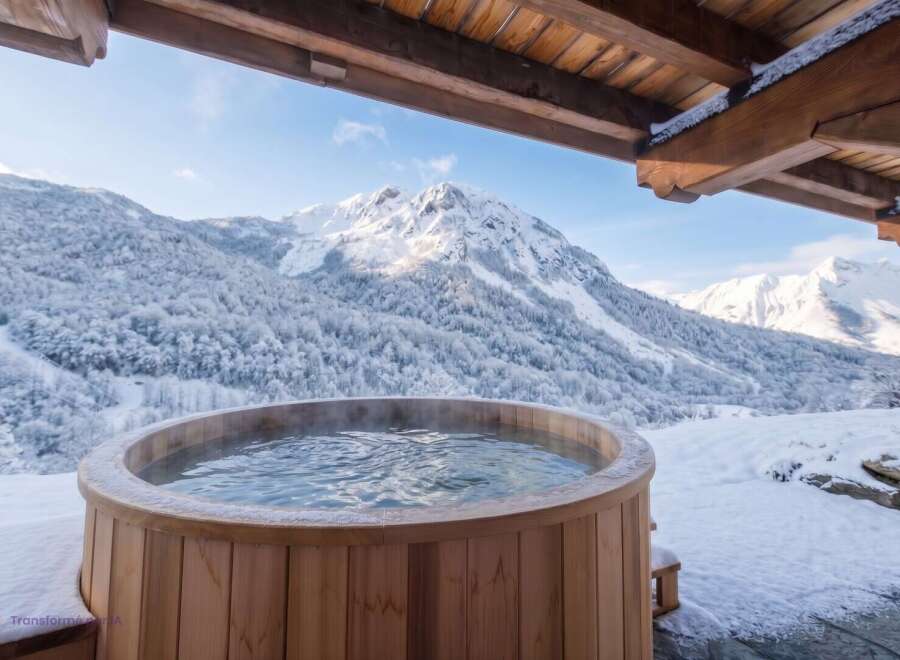 Experience ultimate relaxation with this stunning outdoor hot tub, perfectly situated to offer breathtaking views of snow-capped mountains.