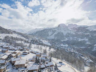 Experience the charm of alpine living in this picturesque village nestled amidst snow-capped mountains.