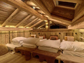 Experience rustic charm and cozy comfort in this mountain retreat bedroom.