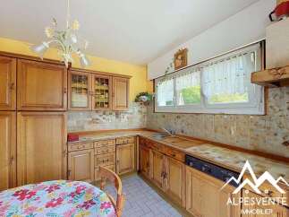 Discover this charming kitchen featuring warm, traditional wooden cabinetry and a functional layout.