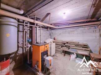 Discover the functional basement of this property, featuring a robust boiler system and ample storage space.