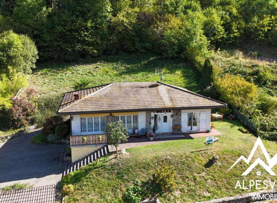 Nestled amidst lush greenery, this charming property offers a serene mountain retreat.