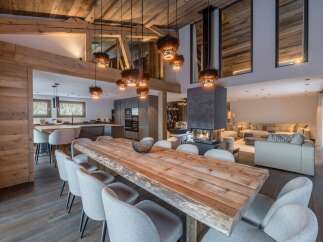 Experience luxurious mountain living in this stunning open-concept dining and living area.