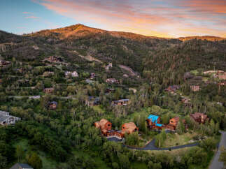 Nestled amidst a lush forest, this collection of luxury mountain homes offers unparalleled privacy and breathtaking natural beauty.