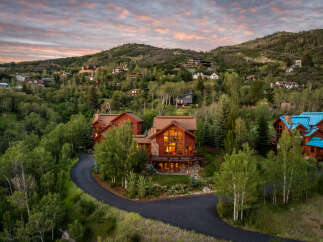 Nestled amidst lush greenery and rolling hills, this stunning mountain home offers breathtaking views and luxurious living.