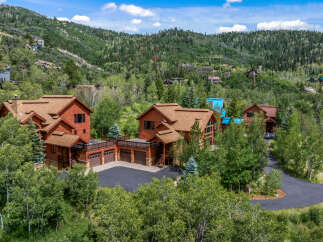 Nestled amidst a lush forest, this stunning mountain home offers unparalleled privacy and breathtaking natural beauty.