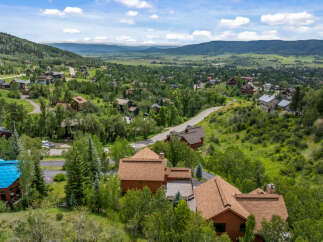 Nestled amidst lush greenery and rolling hills, this stunning property offers a serene mountain retreat.