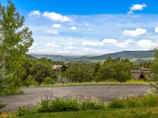Nestled amidst lush greenery and rolling hills, this property offers a serene mountain retreat.