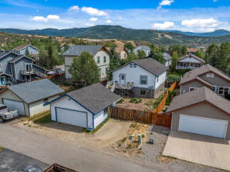 Discover this charming residential neighborhood nestled against a backdrop of rolling hills and majestic mountains.