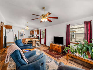 Step into this inviting living space featuring comfortable blue recliners perfect for relaxation.
