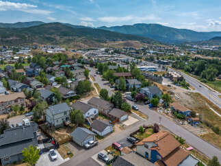 Discover this charming suburban neighborhood nestled against a backdrop of rolling hills and majestic mountains.