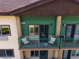 Enjoy outdoor living on this charming balcony, perfect for morning coffee or evening relaxation.