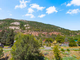 Nestled against a majestic mountain backdrop, this property offers a serene escape with stunning natural views.