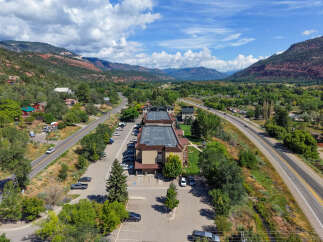 Discover this prime commercial property nestled in a scenic valley, offering excellent visibility and accessibility.