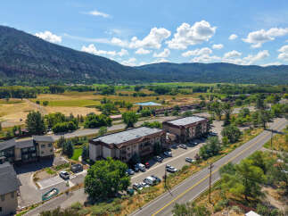 Discover this stunning property nestled against a majestic mountain backdrop, offering breathtaking views and a serene environment.