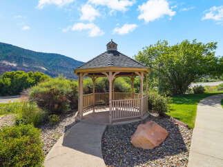 Discover this charming gazebo, a perfect retreat nestled amidst lush greenery and scenic mountain views.