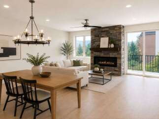 Experience modern living in this stunning open-concept space, featuring a cozy living area with a stone fireplace and a spacious dining area perfect for entertaining.