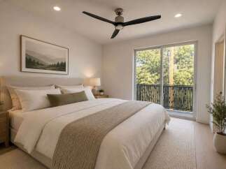 Experience serene living in this beautifully appointed bedroom, featuring a plush king-sized bed and a calming neutral color palette.