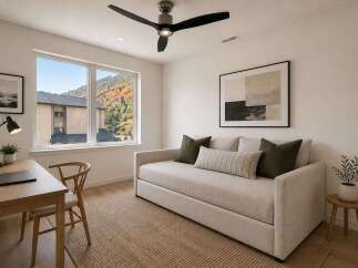 Discover this inviting space featuring a comfortable daybed with plush pillows, perfect for relaxation or as a stylish seating area.