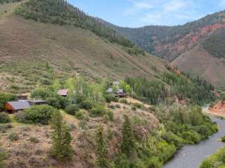 Nestled amidst a breathtaking mountain landscape, this property offers unparalleled tranquility and natural beauty.