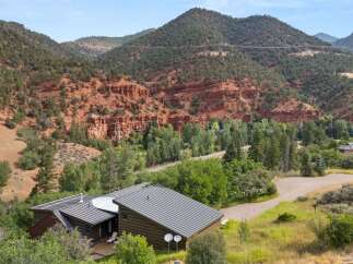 Nestled amidst stunning red rock formations and lush greenery, this property offers a unique blend of natural beauty and modern living.