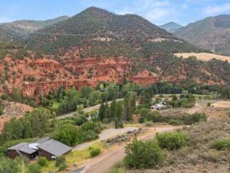 Nestled amidst stunning red rock formations and lush greenery, this property offers a serene mountain retreat.