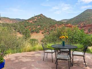 Enjoy breathtaking mountain views from this stunning patio, perfect for outdoor dining and relaxation.
