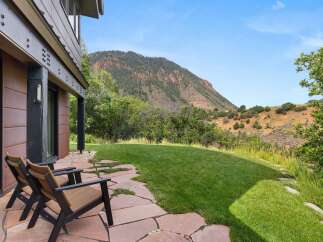 Enjoy breathtaking mountain views from this stunning property's patio, perfect for outdoor relaxation.