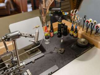 Discover the ultimate fly tying station, perfect for anglers and craft enthusiasts.